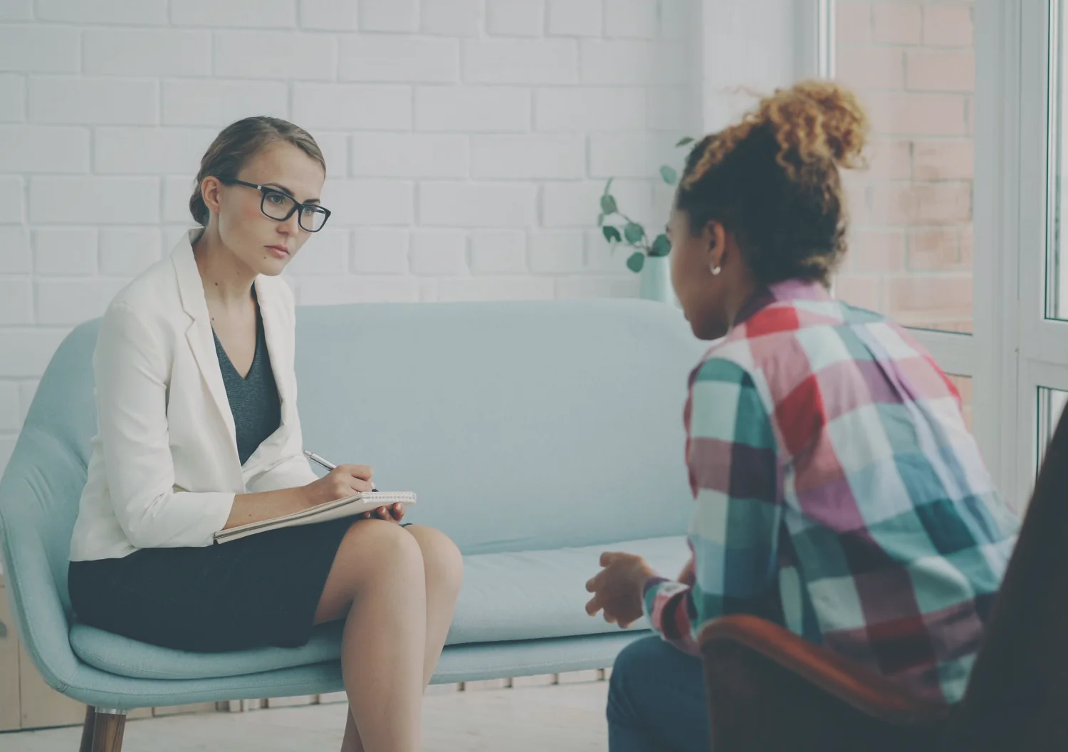 A one on one coaching session in a bright room